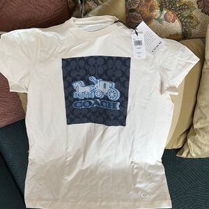 Coach:  White Tee with Blue Graphic. Beautiful. Classy.